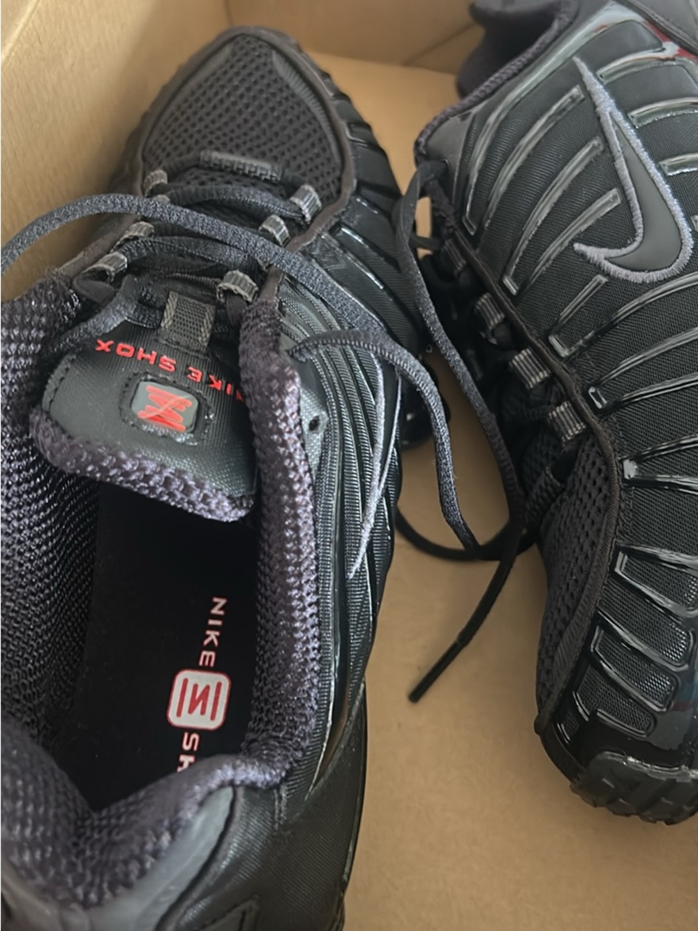 Nike Shox Black Sneakers with Red Logo Accent